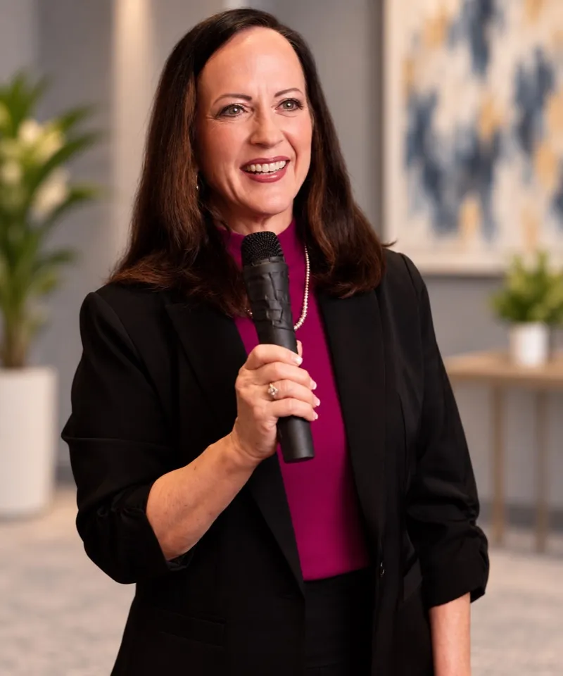 Karen Hall speaking with a microphone